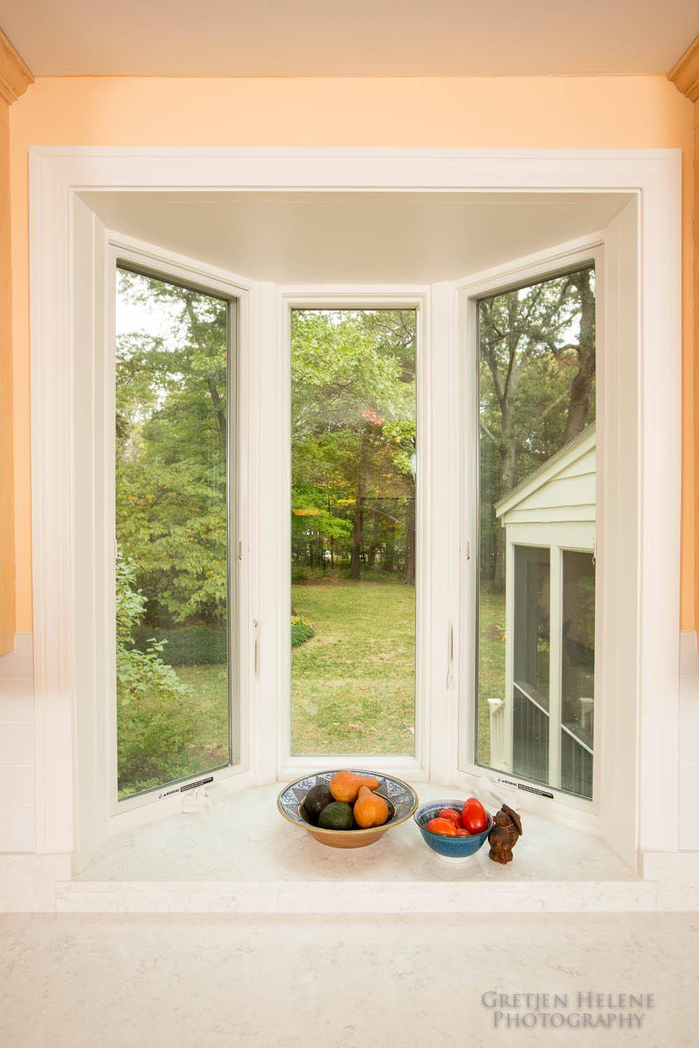 Quartz countertop material continues into the window bay